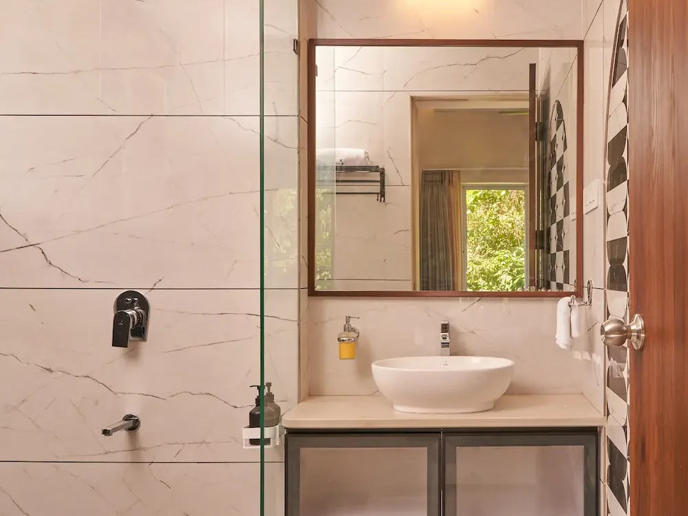 Clean bathroom with modern fixtures in a 5BHK Alibaug villa
