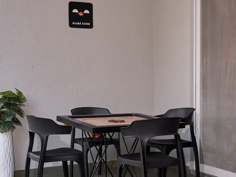 Indoor game zone with carrom board in a luxury villa in Alibaug