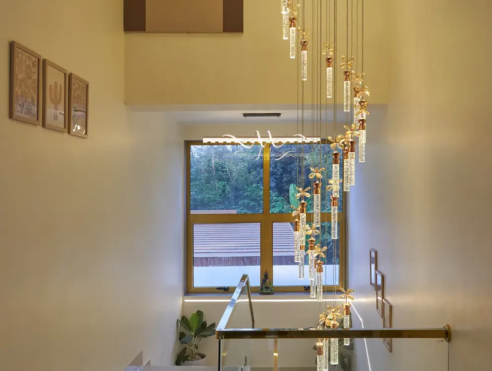 casa-sereno-resort-privy-stays-alibaug-staircase-crystal-chandelier